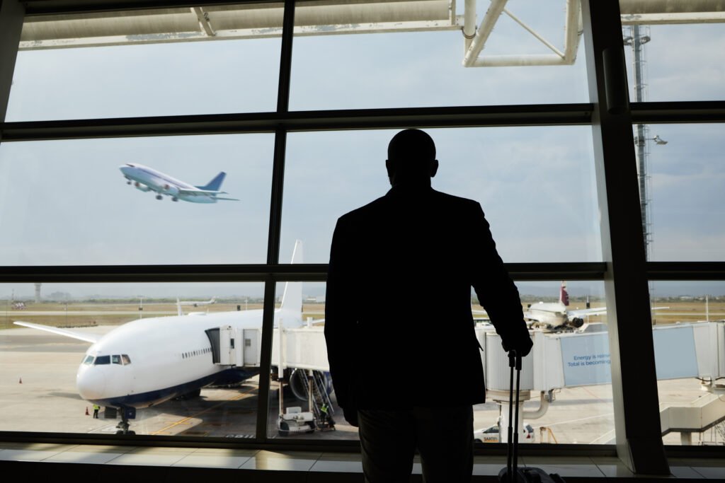 airplane travel or silhouette man watch plane fly 2026 01 09 09 39 15 utc